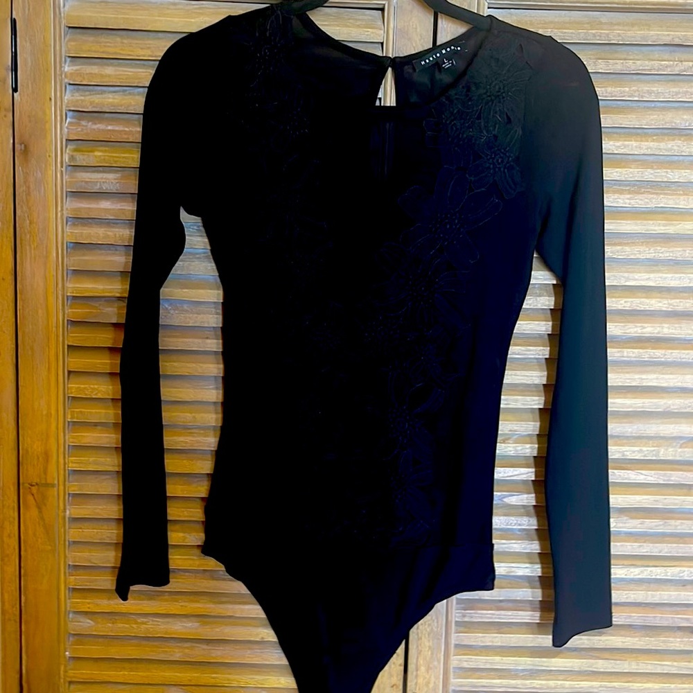 Sheer appliquéd bodysuit.  Stretch. Says large runs small. Like new.